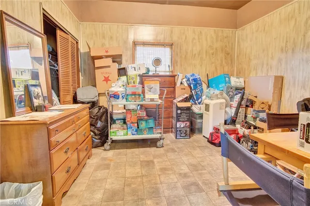 a bedroom with a bed lamps and window
