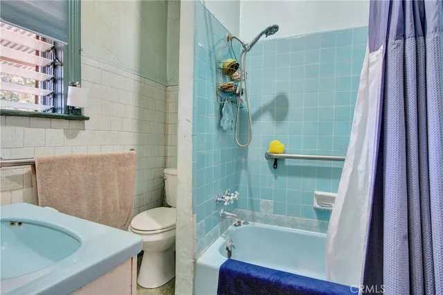 a kitchen with stainless steel appliances kitchen island granite countertop a sink and cabinets