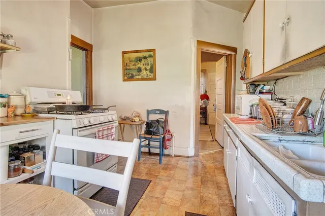 a white refrigerator freezer sitting inside of a kitchen