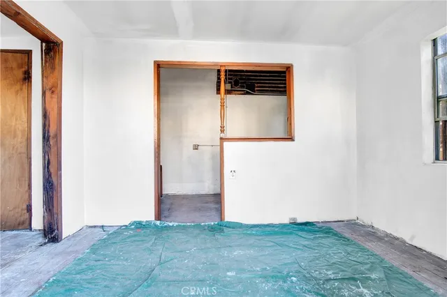 a kitchen with a stove a sink and a refrigerator
