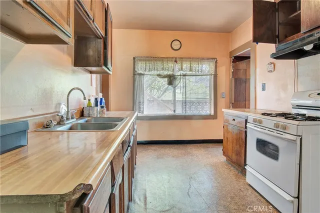 a bathroom with a shower and a sink