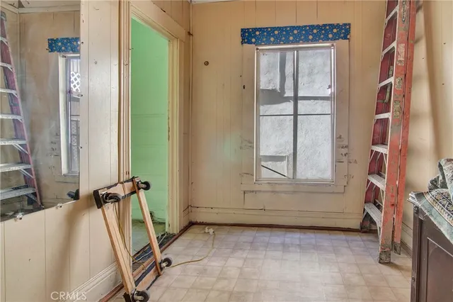 a kitchen with granite countertop cabinets and black stainless steel appliances