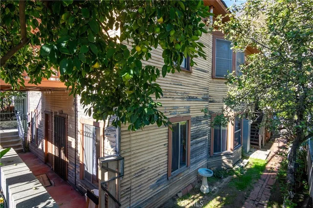 a view of a patio with a table and chairs and wooden floor