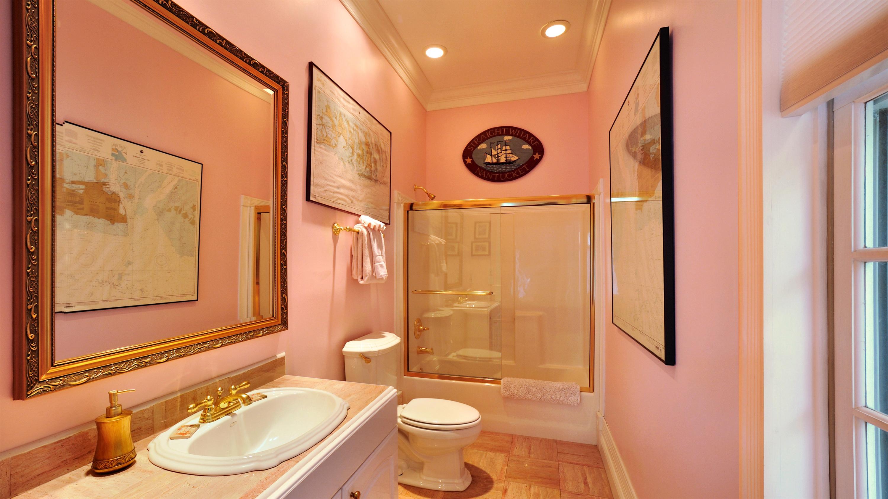 58 Front Street Key West, FL 33040 - Photo 12 of 28 a bathroom with a sink and a mirror