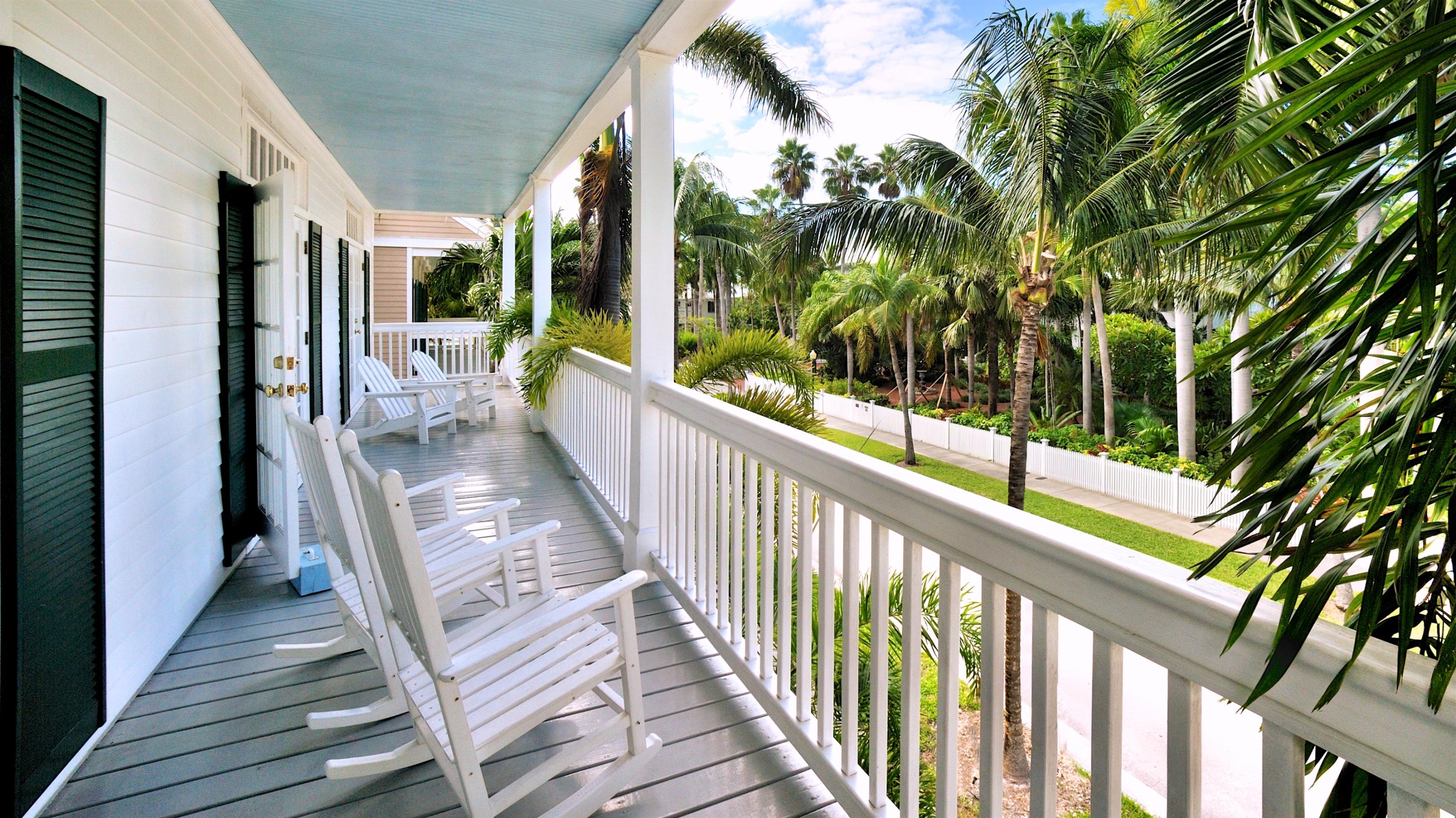 58 Front Street Key West, FL 33040 - Photo 14 of 28 a view of a balcony with wooden floor