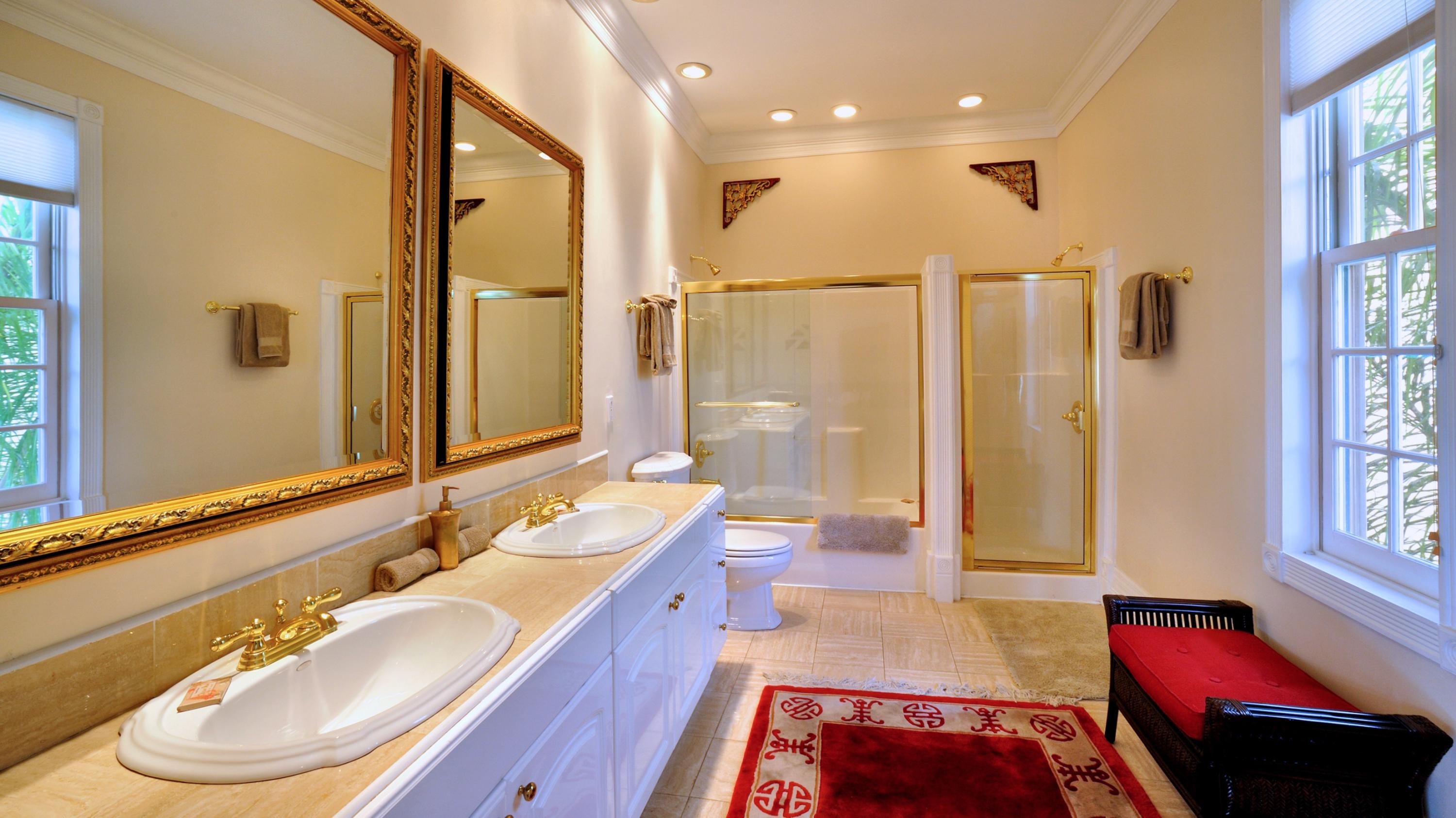 58 Front Street Key West, FL 33040 - Photo 17 of 28 a bathroom with a tub sink and mirror