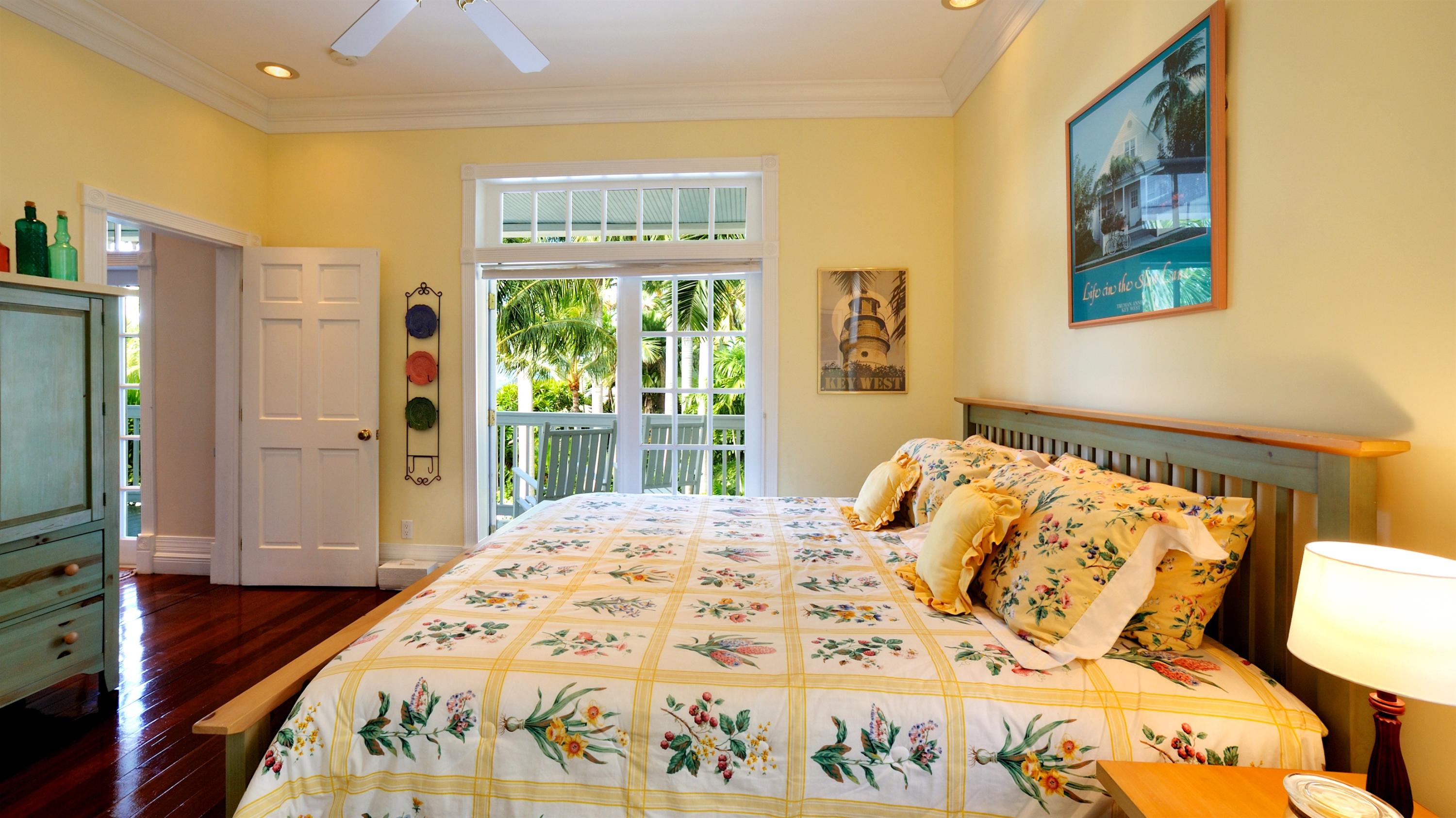 58 Front Street Key West, FL 33040 - Photo 20 of 28 a bedroom with a bed and a window