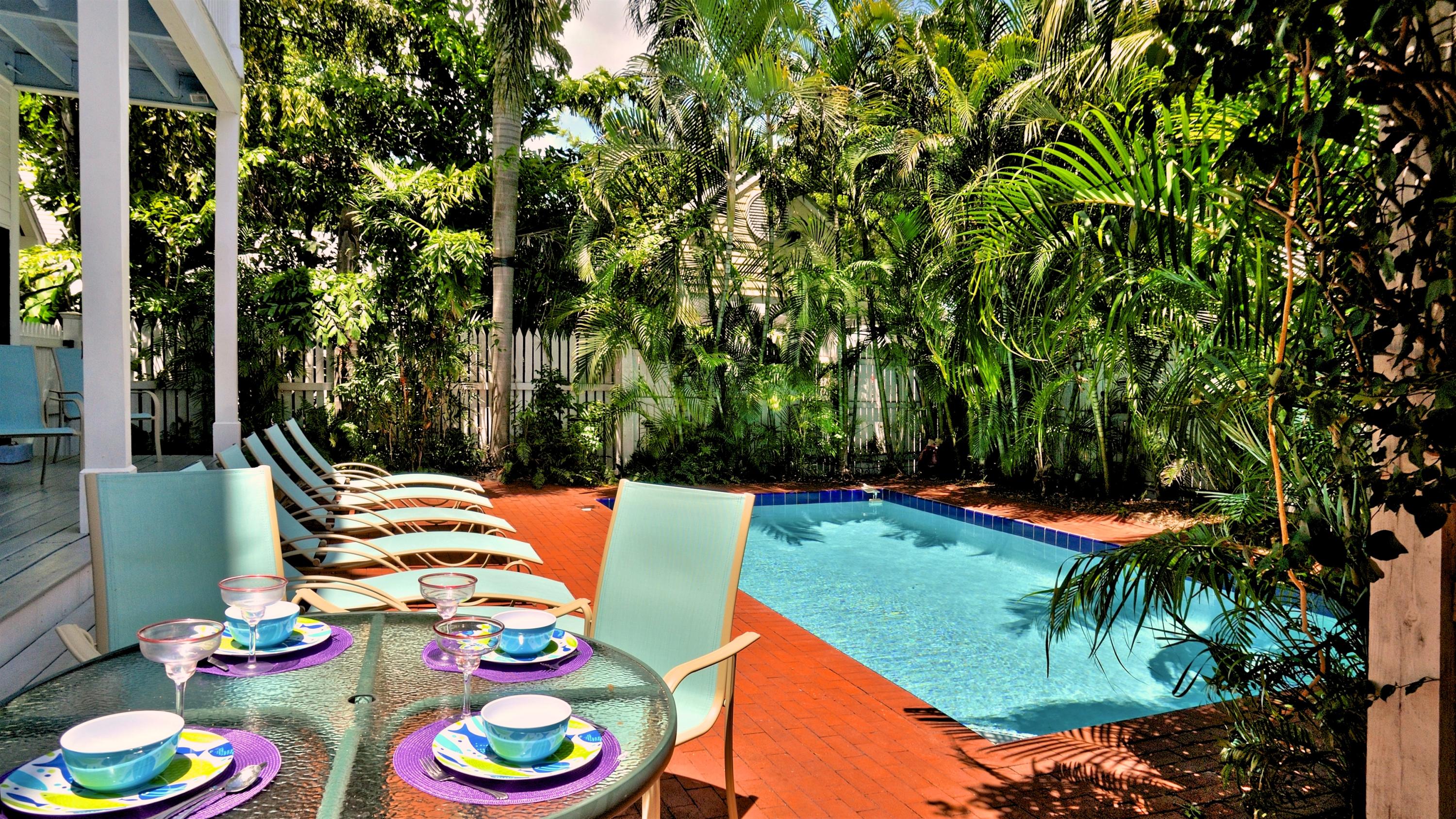 58 Front Street Key West, FL 33040 - Photo 3 of 28 a backyard of a house with lots of green space