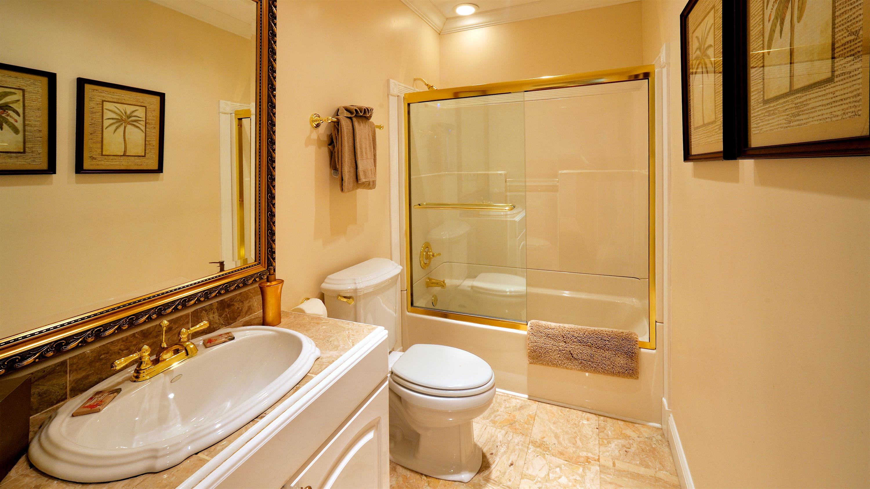 58 Front Street Key West, FL 33040 - Photo 25 of 28 a bathroom with a sink toilet and shower