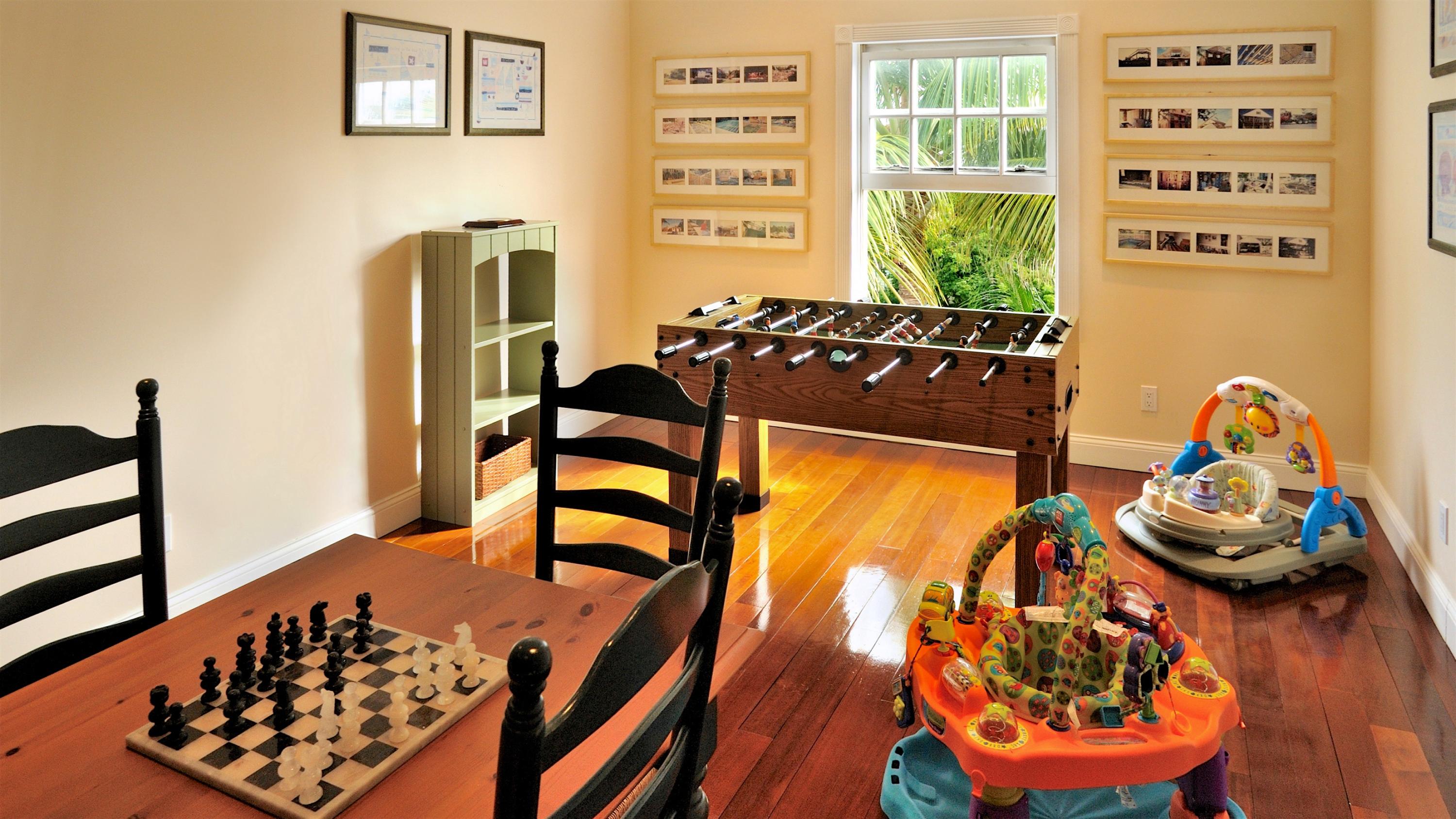 58 Front Street Key West, FL 33040 - Photo 27 of 28 wooden floor in a room and a window