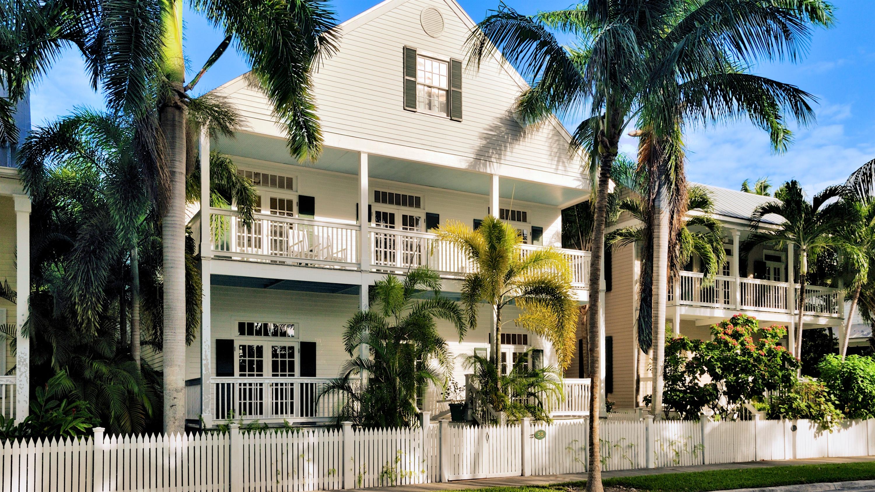 58 Front Street Key West, FL 33040 - Photo 28 of 28 a view of a house with a palm tree