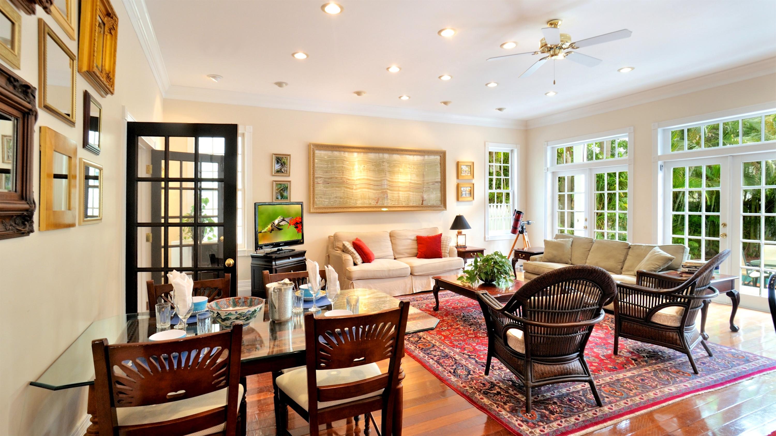 58 Front Street Key West, FL 33040 - Photo 4 of 28 a living room with furniture and large windows