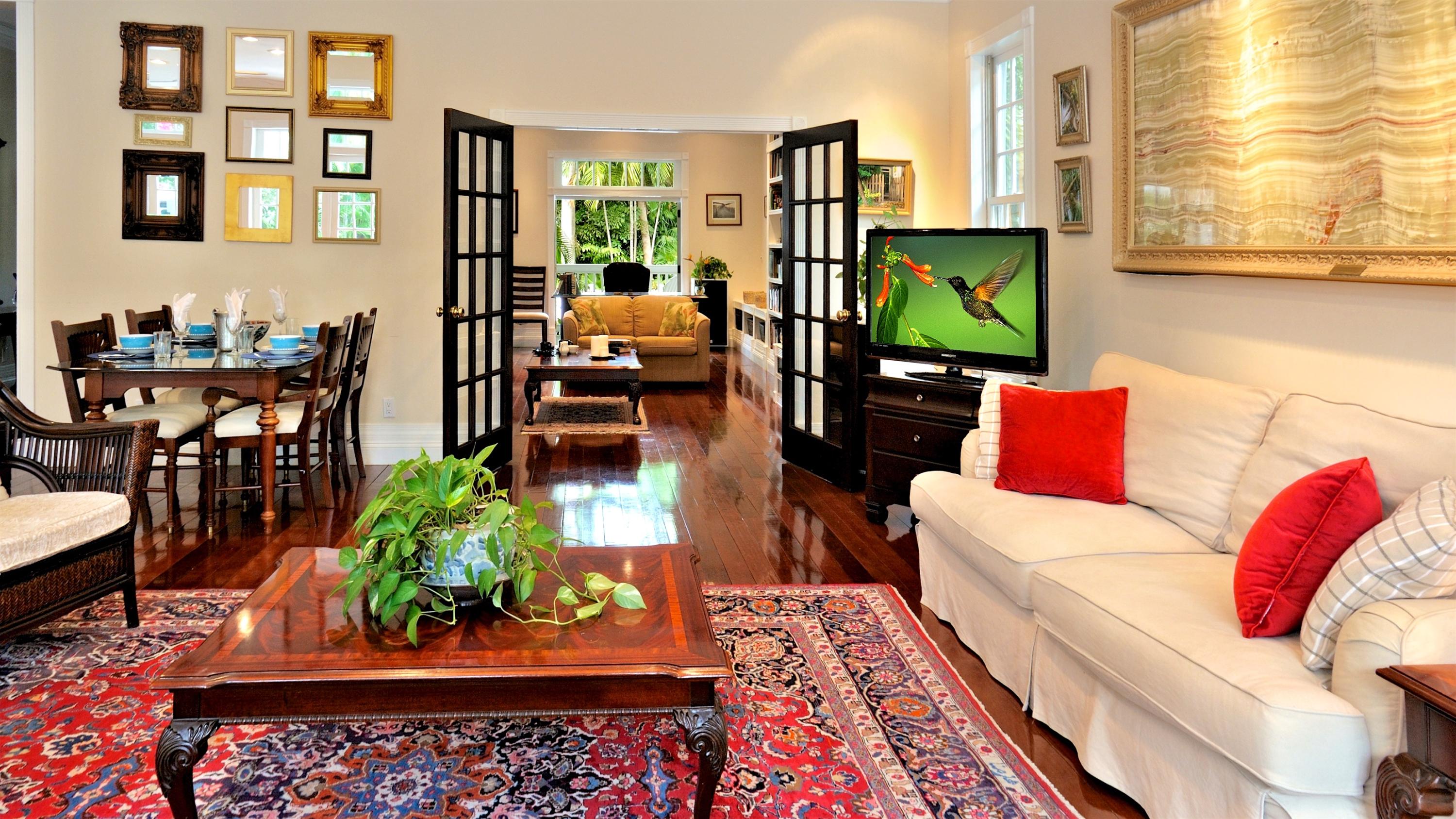 58 Front Street Key West, FL 33040 - Photo 5 of 28 a living room with furniture a rug and a window