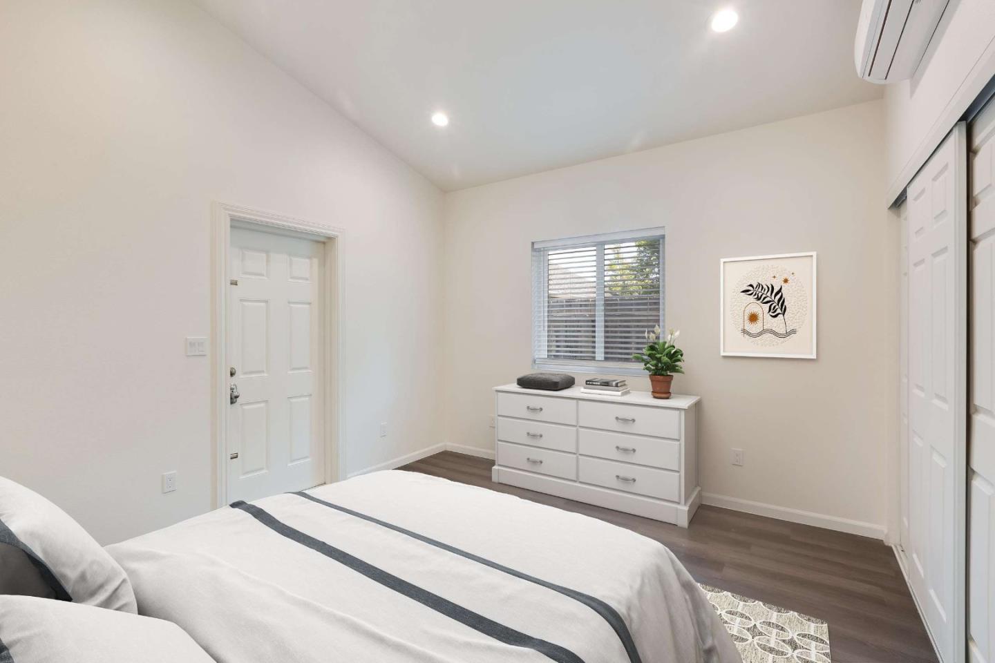 2360 Middlefield Road Palo Alto, CA 94301 - Photo 15 of 18 a bedroom with a bed and a window