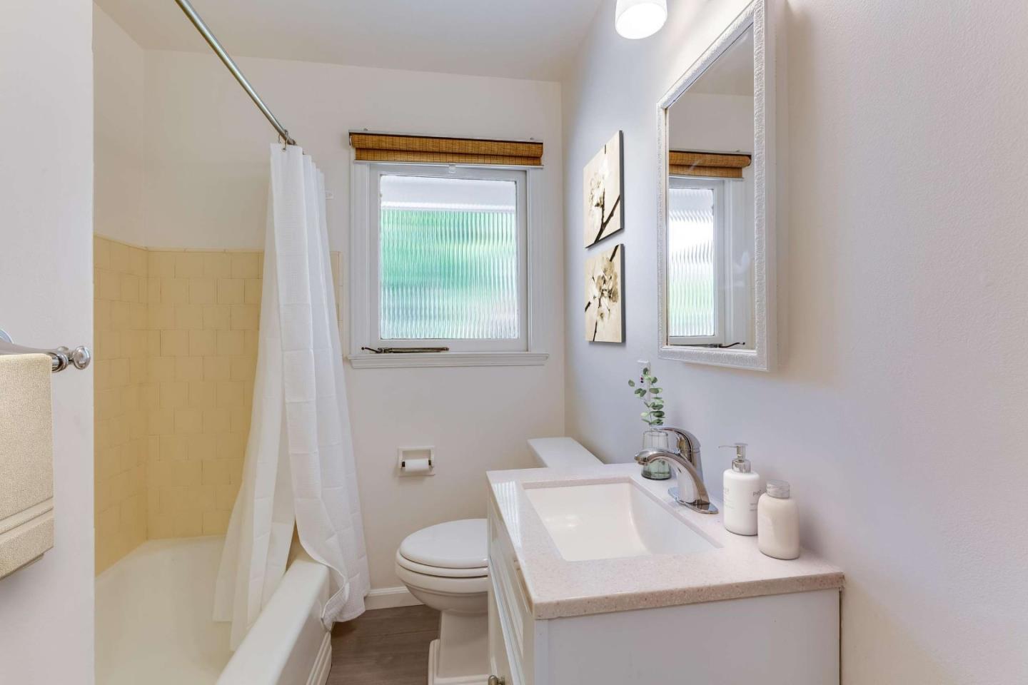 2360 Middlefield Road Palo Alto, CA 94301 - Photo 6 of 18 a bathroom with a sink toilet and shower