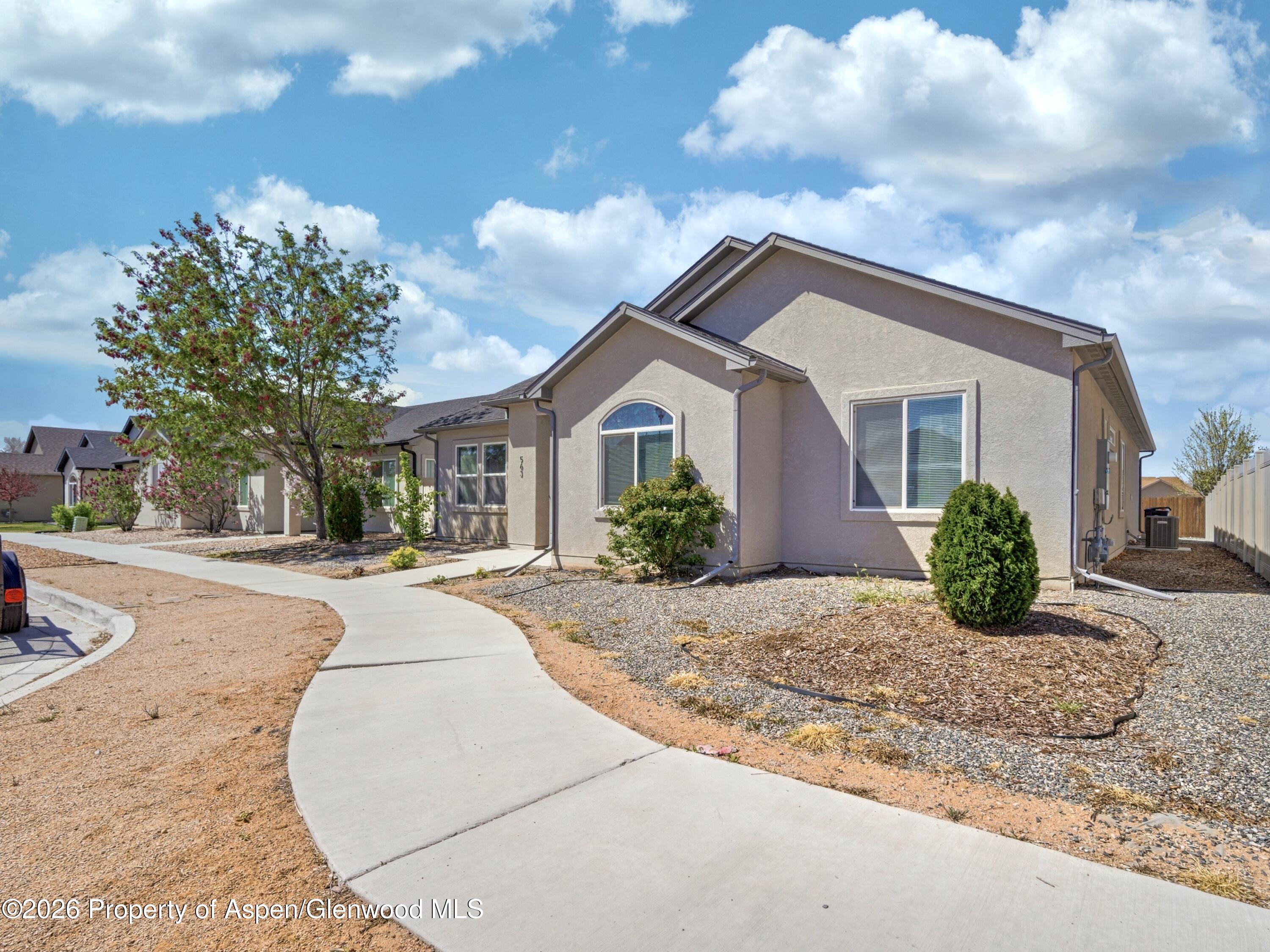 563 Red Cedar Way Grand Junction, CO 81504 - Photo 2 of 30 a view of a house with a patio