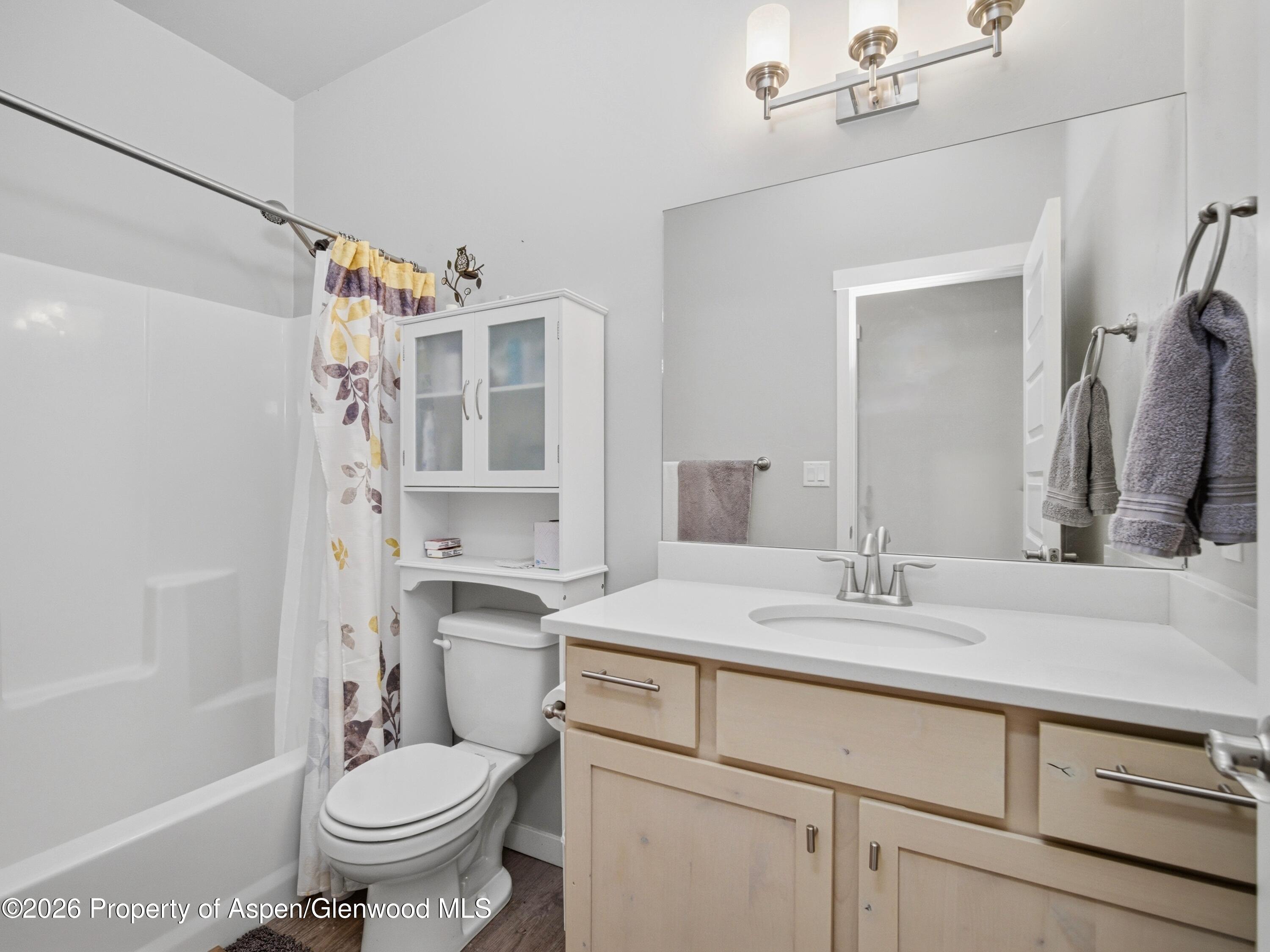 563 Red Cedar Way Grand Junction, CO 81504 - Photo 22 of 30 a bathroom with a sink toilet and shower