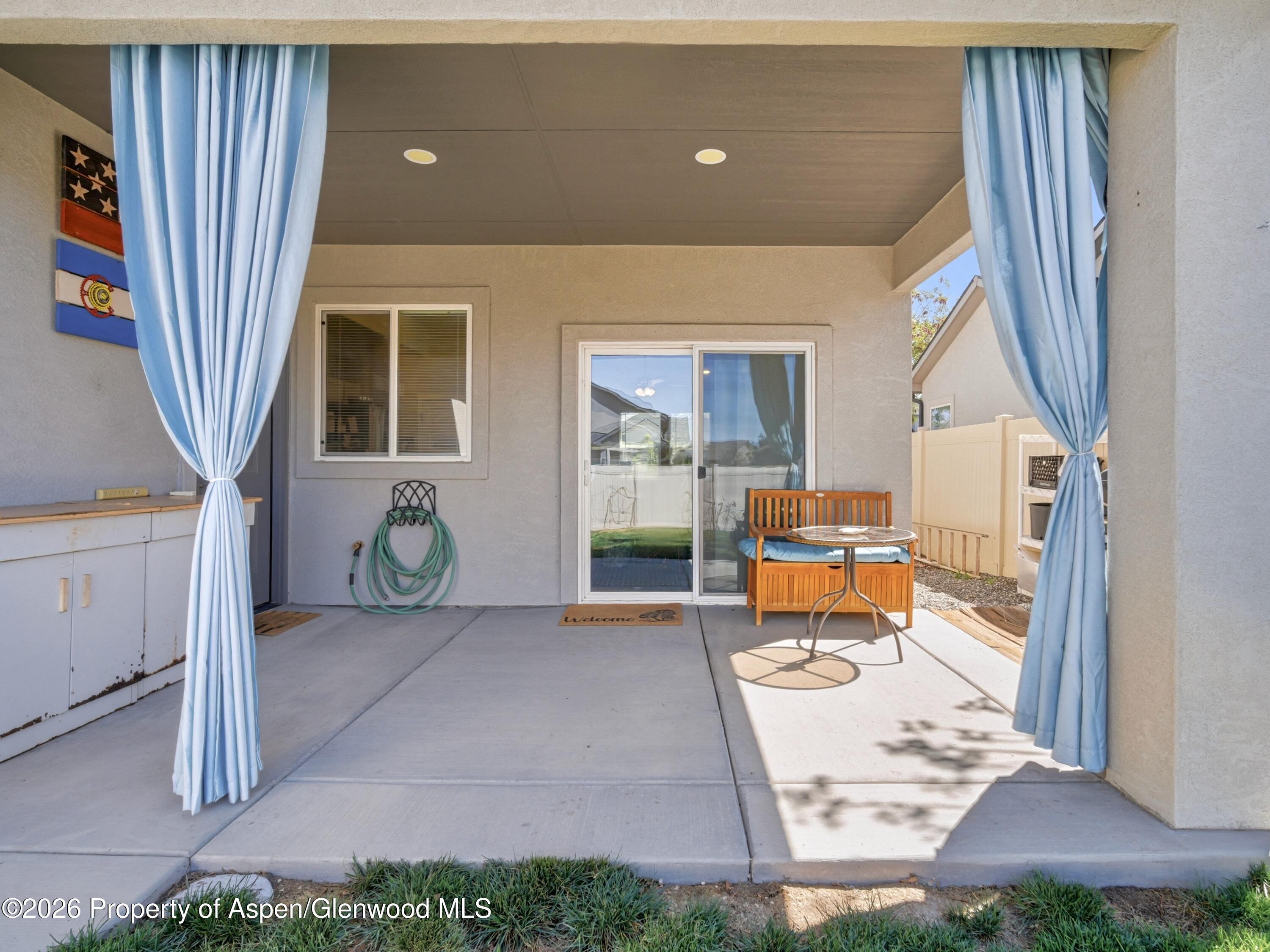 563 Red Cedar Way Grand Junction, CO 81504 - Photo 26 of 30 a living room with furniture and a window