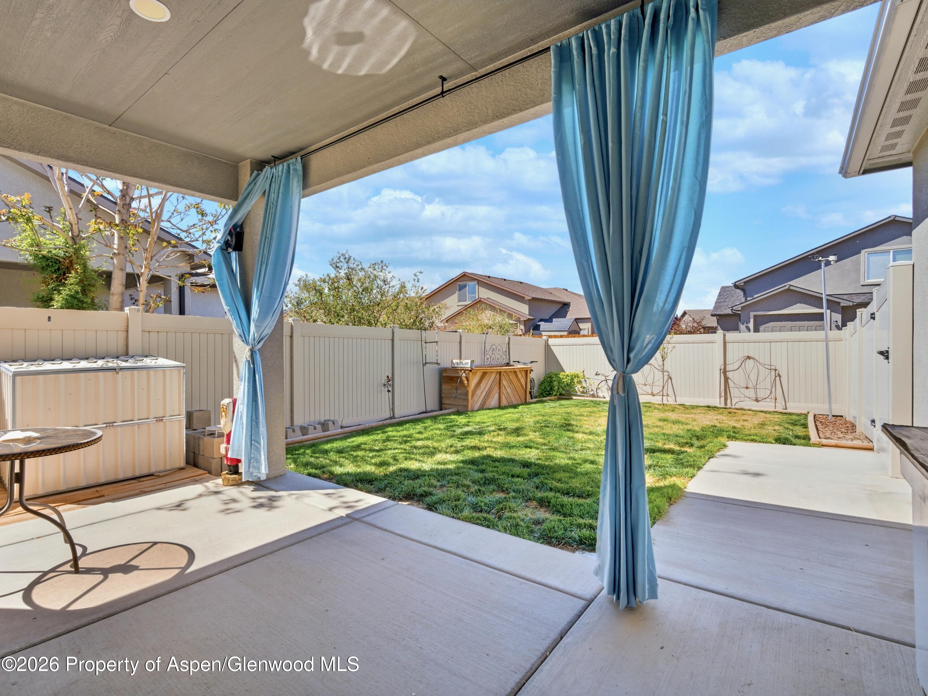 563 Red Cedar Way Grand Junction, CO 81504 - Photo 27 of 30 a front view of a house with garden