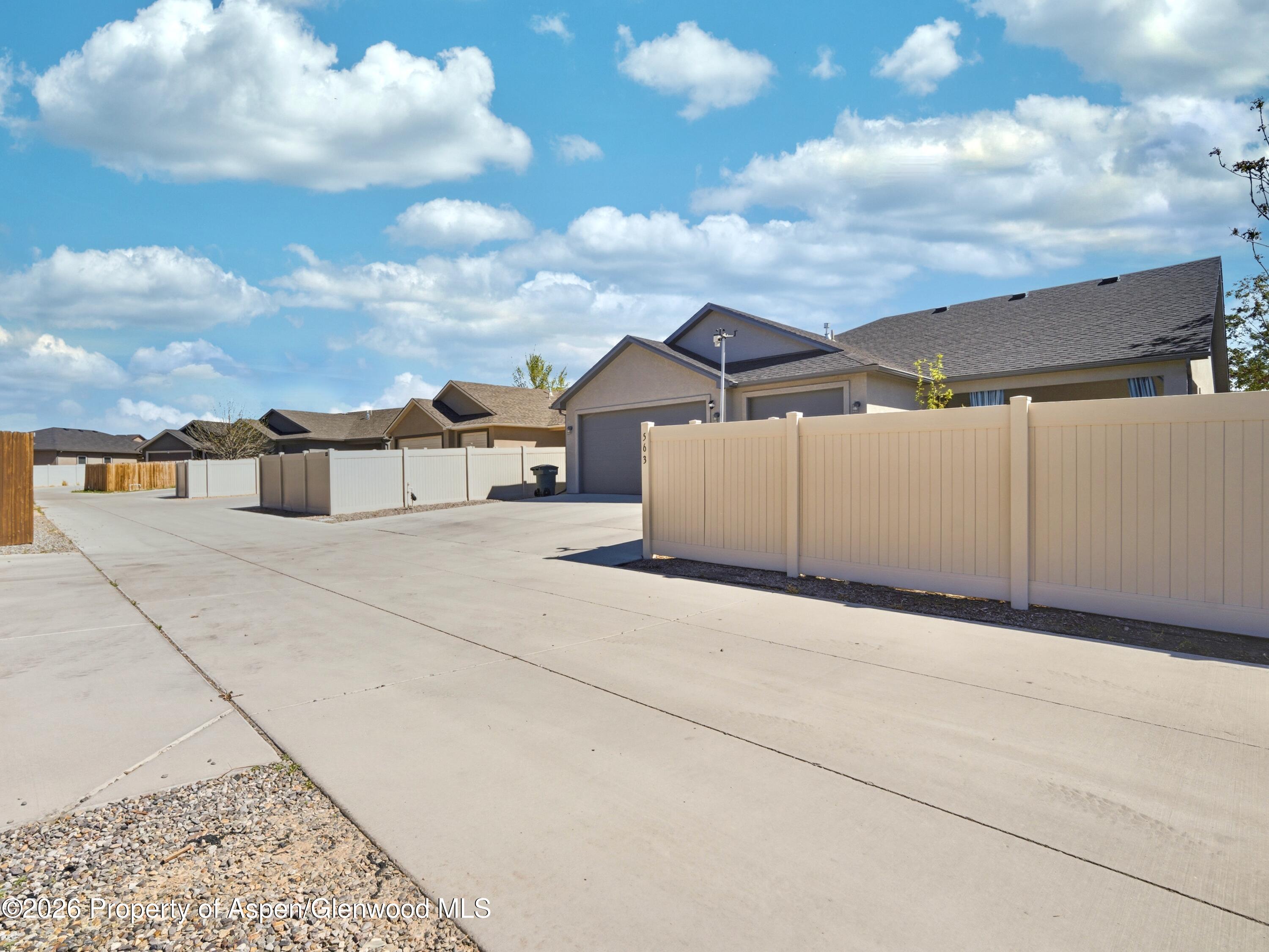 563 Red Cedar Way Grand Junction, CO 81504 - Photo 30 of 30 a view of a house with a yard