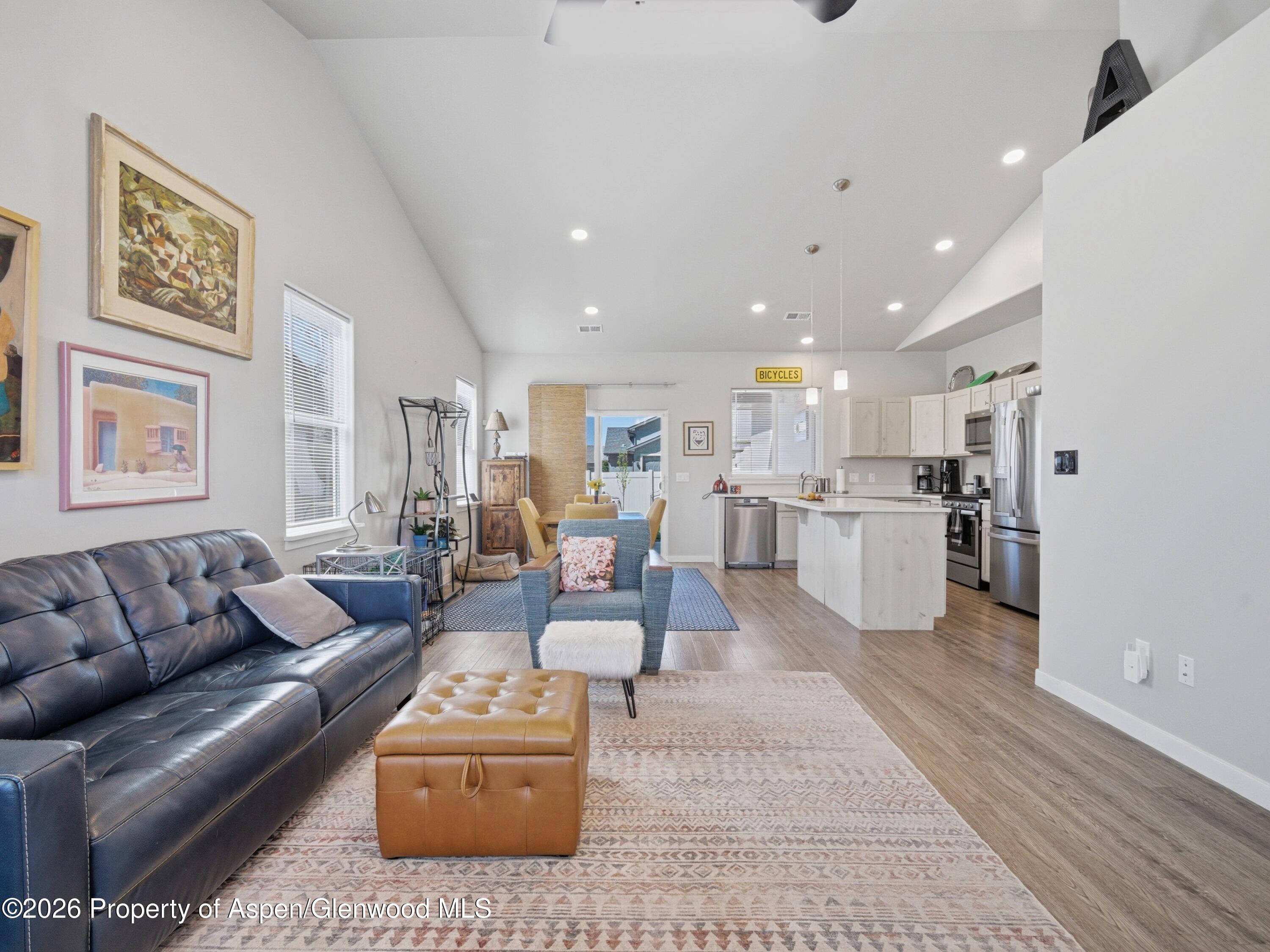 563 Red Cedar Way Grand Junction, CO 81504 - Photo 5 of 30 a living room with furniture and kitchen view