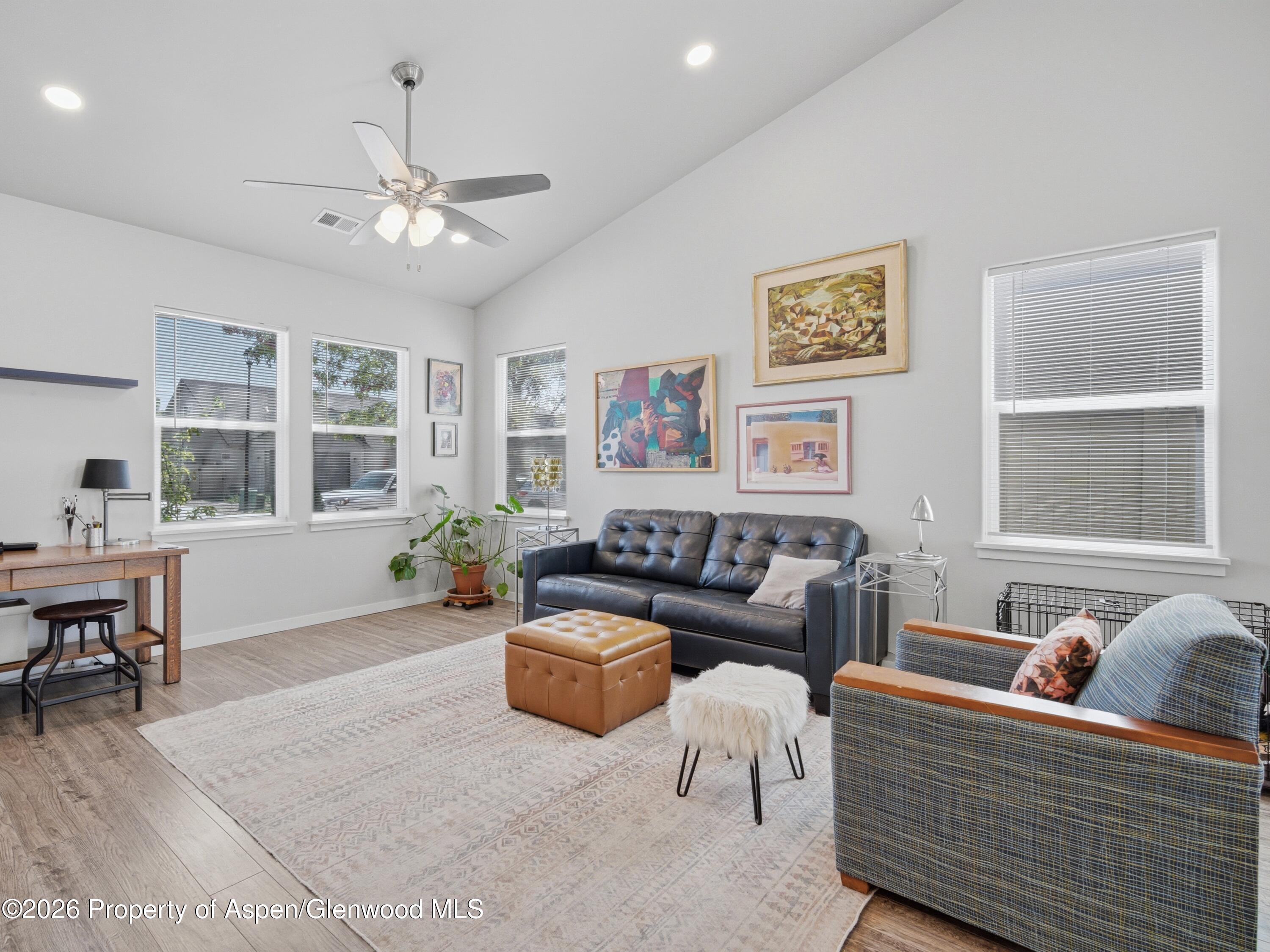 563 Red Cedar Way Grand Junction, CO 81504 - Photo 6 of 30 a living room with furniture and windows