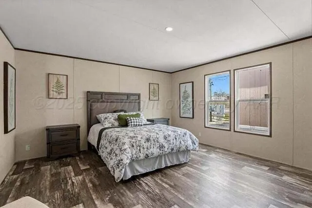 a bedroom with a large bed and a window