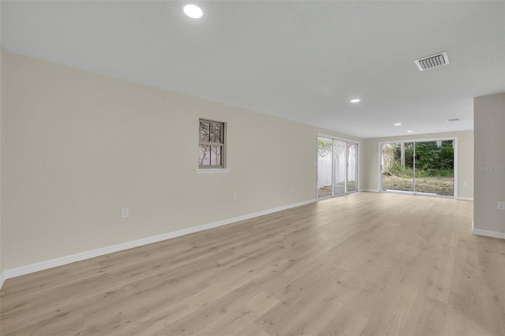 31201 Merry Road Tavares, FL 32778 - Photo 9 of 40 a view of an empty room with a window