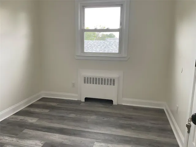 an view of an empty room and a window