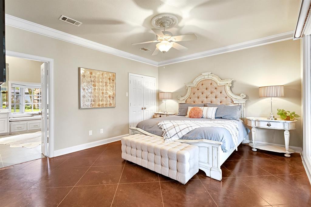 103 Glenn Road Mabank, TX 75156 - Photo 14 of 38 a bedroom with a bed and a chandelier