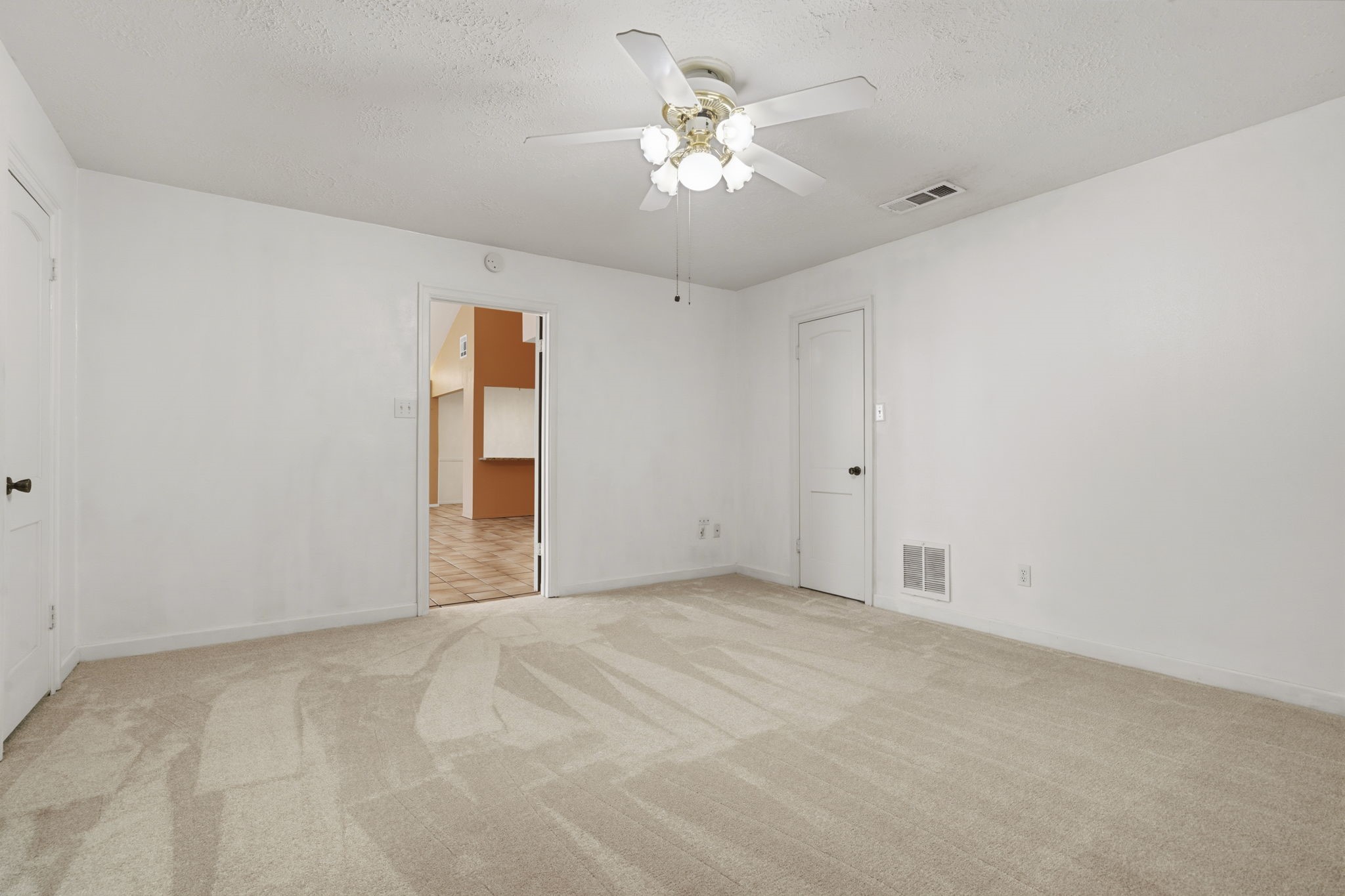6102 Redding Road Houston, TX 77036 - Photo 27 of 40 View of the primary bedroom and its connection to the bright sunroom.