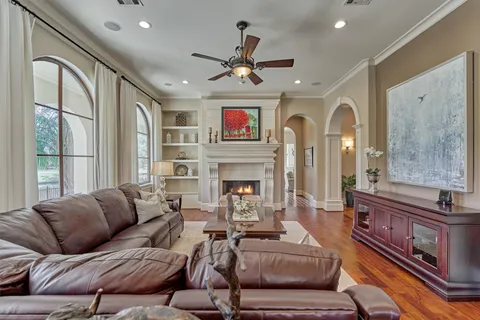a living room with furniture fireplace and flat screen tv