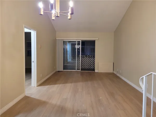 a kitchen with stainless steel appliances granite countertop a sink stove microwave and refrigerator
