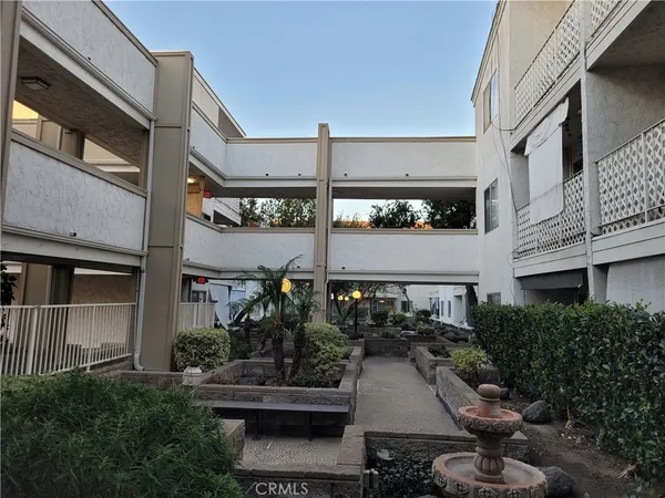 a view of a building with sitting area