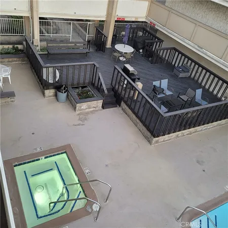 a view of a swimming pool with a house