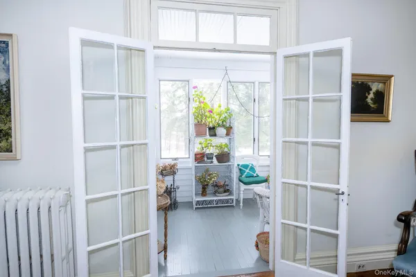 a view of a livingroom with furniture and a window