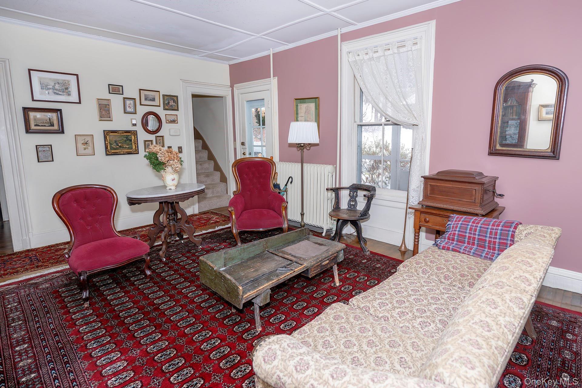819 Van Wagner Road Poughkeepsie, NY 12601 - Photo 18 of 43 Family room with back stairway and door to the screened porch