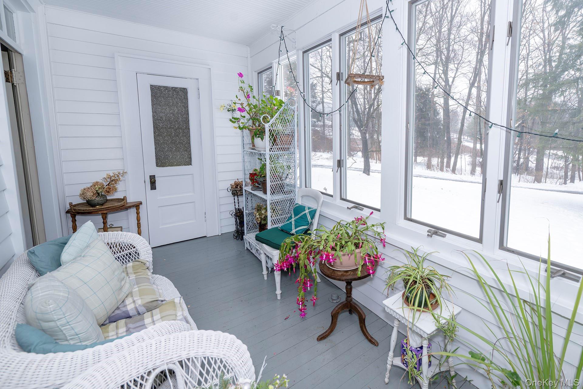 819 Van Wagner Road Poughkeepsie, NY 12601 - Photo 19 of 44 a living room filled with furniture and a potted plant