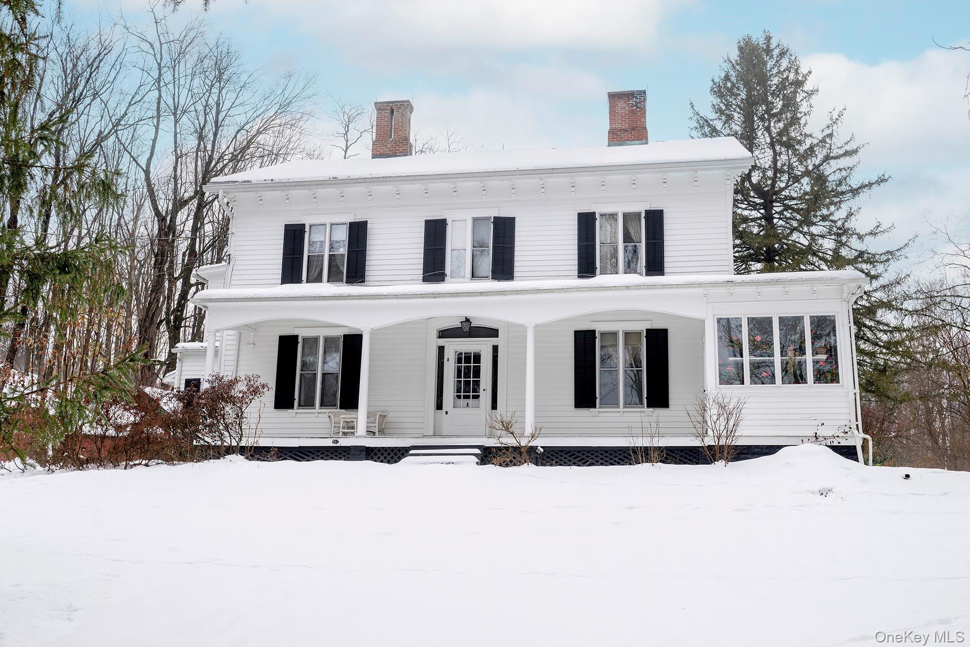 819 Van Wagner Road Poughkeepsie, NY 12601 - Photo 2 of 44 a front view of a house with yard covered in snow