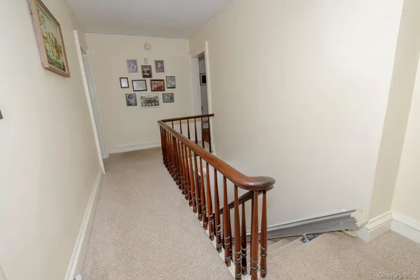 a view of a hallway with stairs