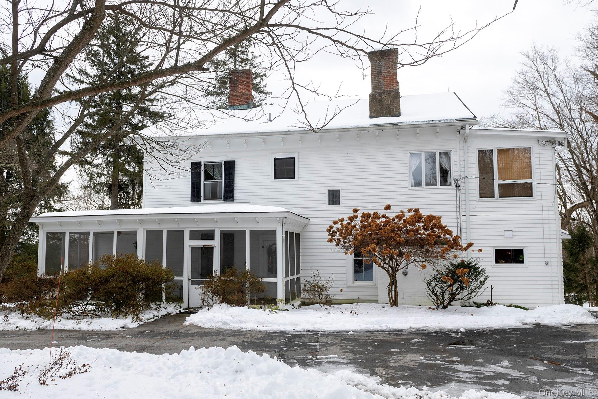 819 Van Wagner Road Poughkeepsie, NY 12601 - Photo 3 of 44 a front view of a house with a yard