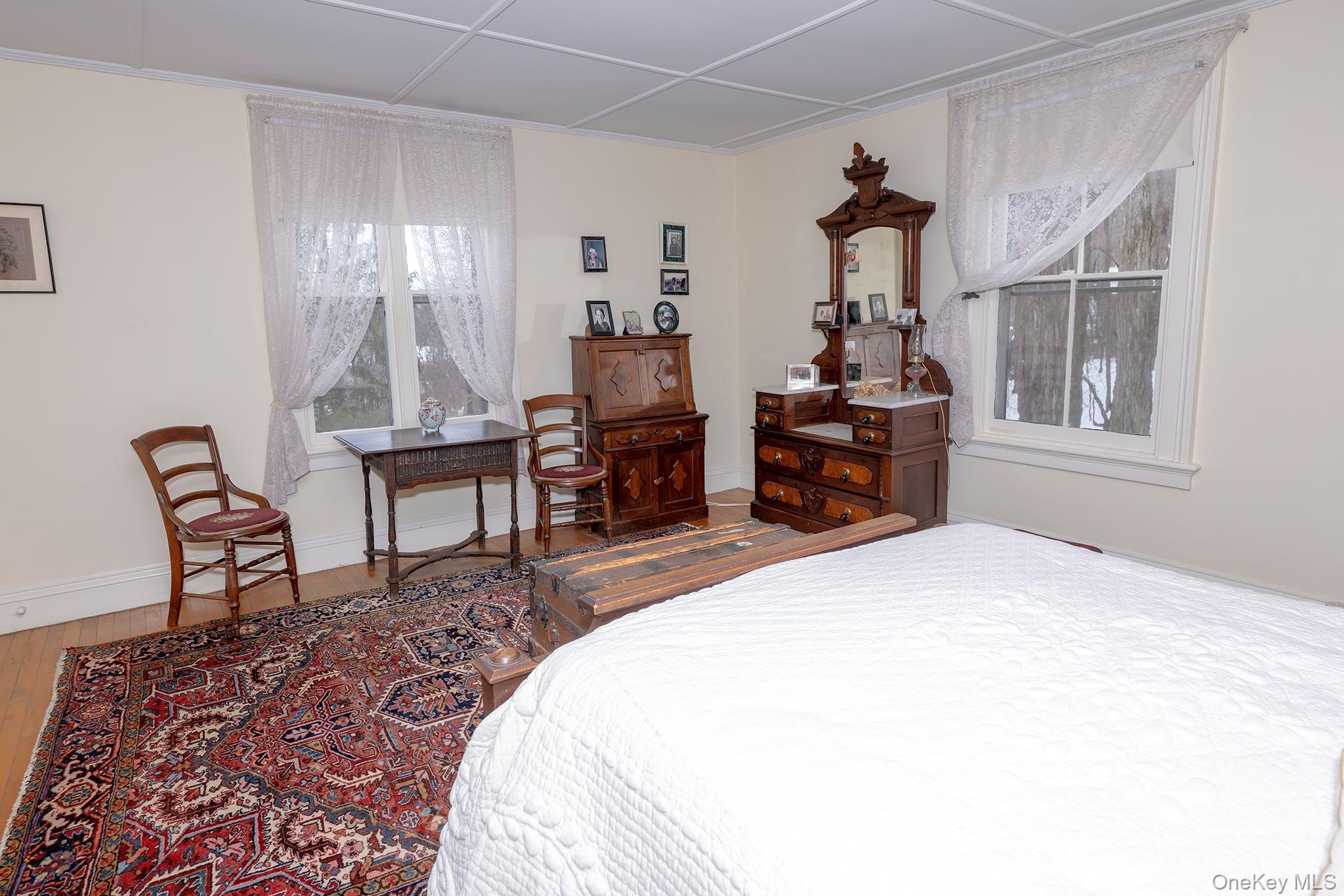 819 Van Wagner Road Poughkeepsie, NY 12601 - Photo 31 of 44 a bedroom with a bed and wooden floor