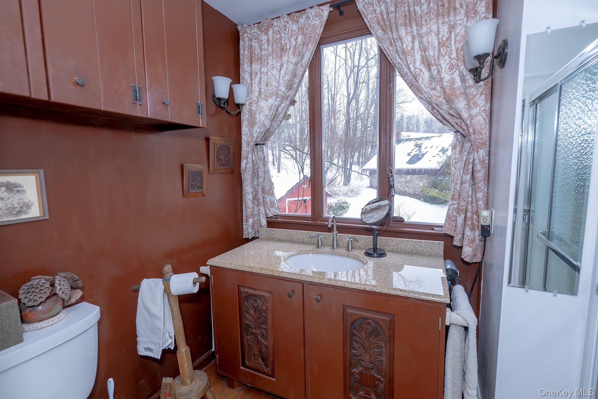 819 Van Wagner Road Poughkeepsie, NY 12601 - Photo 33 of 44 a bathroom with a sink and a mirror