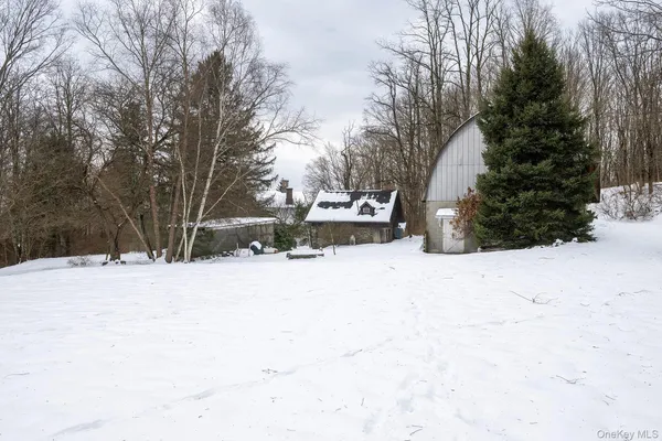 a view of a yard covered in snow
