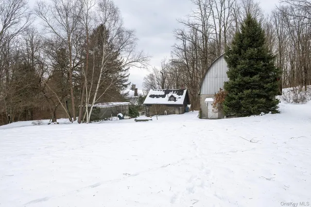 a view of a yard covered in snow
