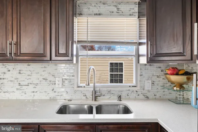 a bathroom with a sink and a window