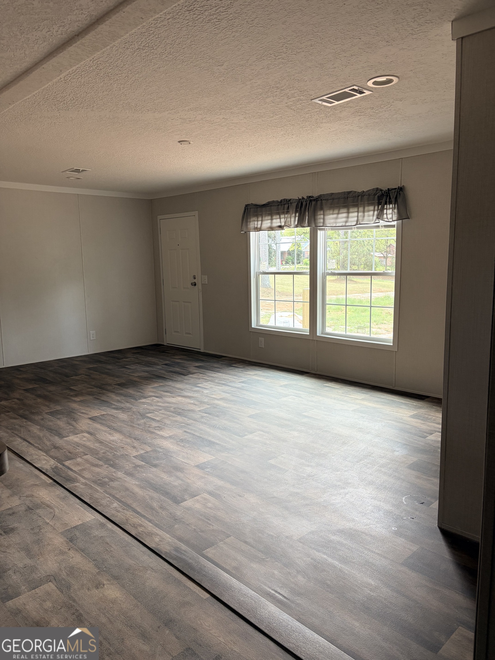 225 Rehoboth Road Bowman, GA 30624 - Photo 11 of 18 a view of an empty room with a window