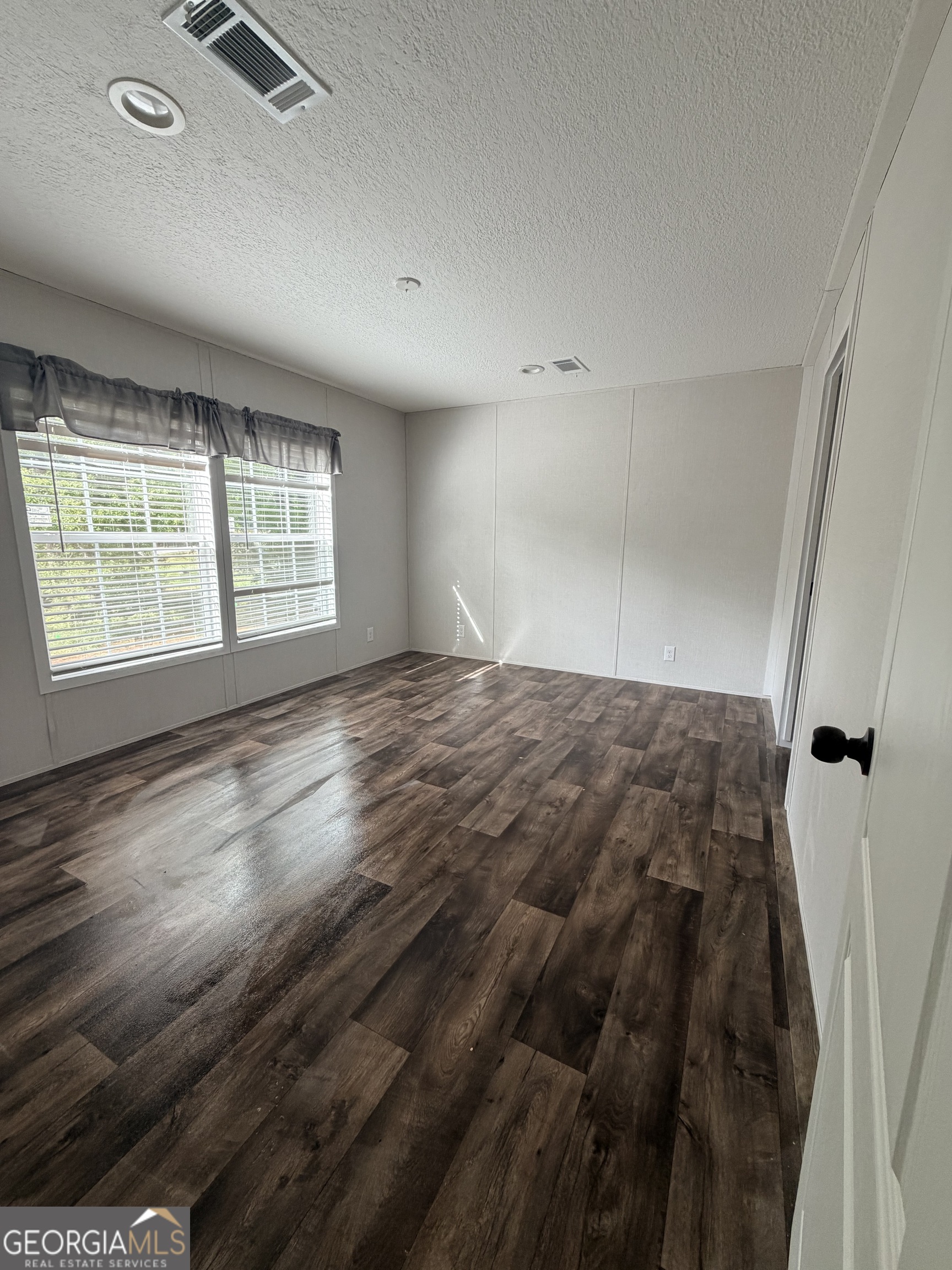 225 Rehoboth Road Bowman, GA 30624 - Photo 14 of 18 a view of an empty room with a window