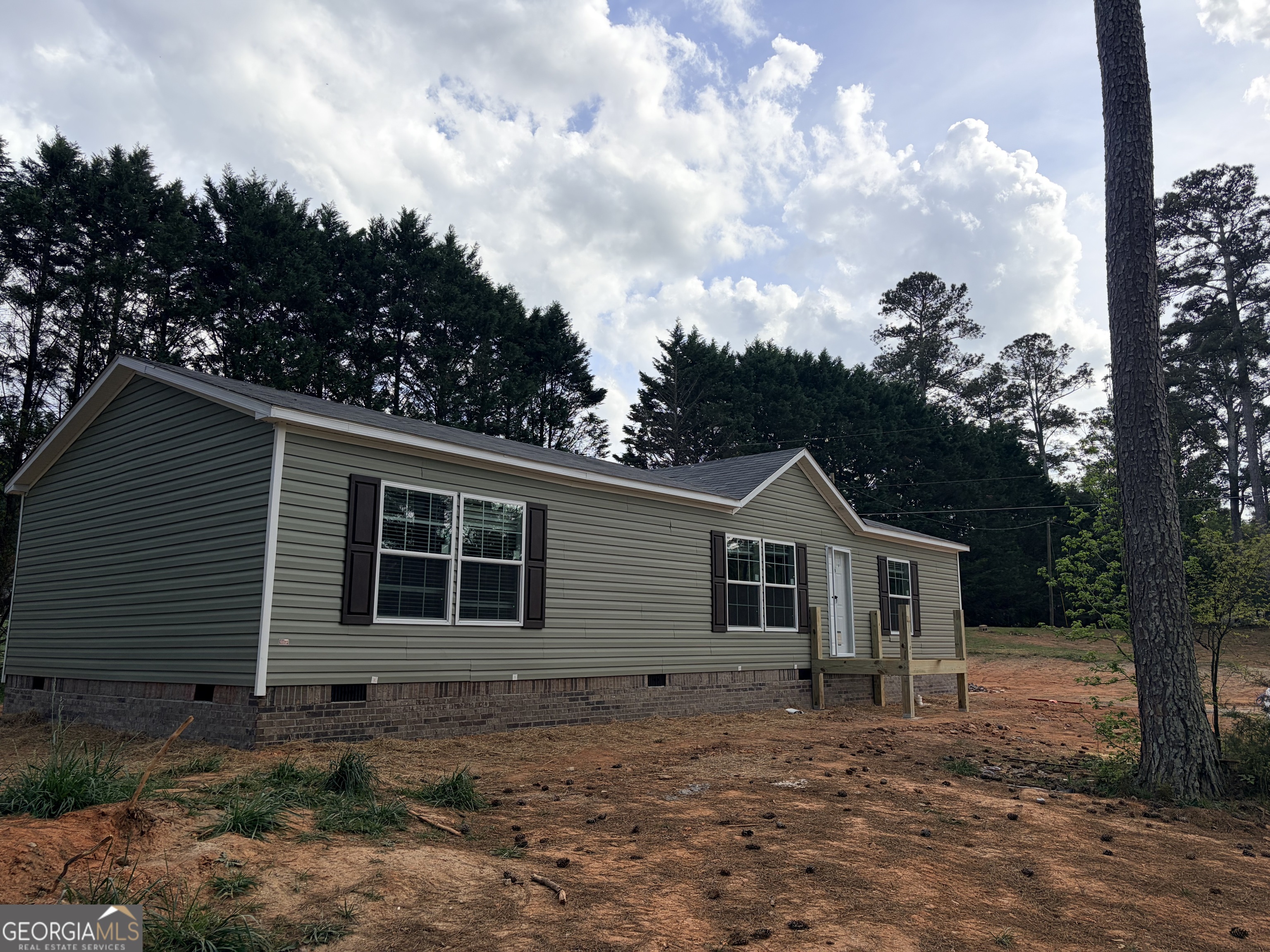 225 Rehoboth Road Bowman, GA 30624 - Photo 3 of 18 a front view of a house with garden