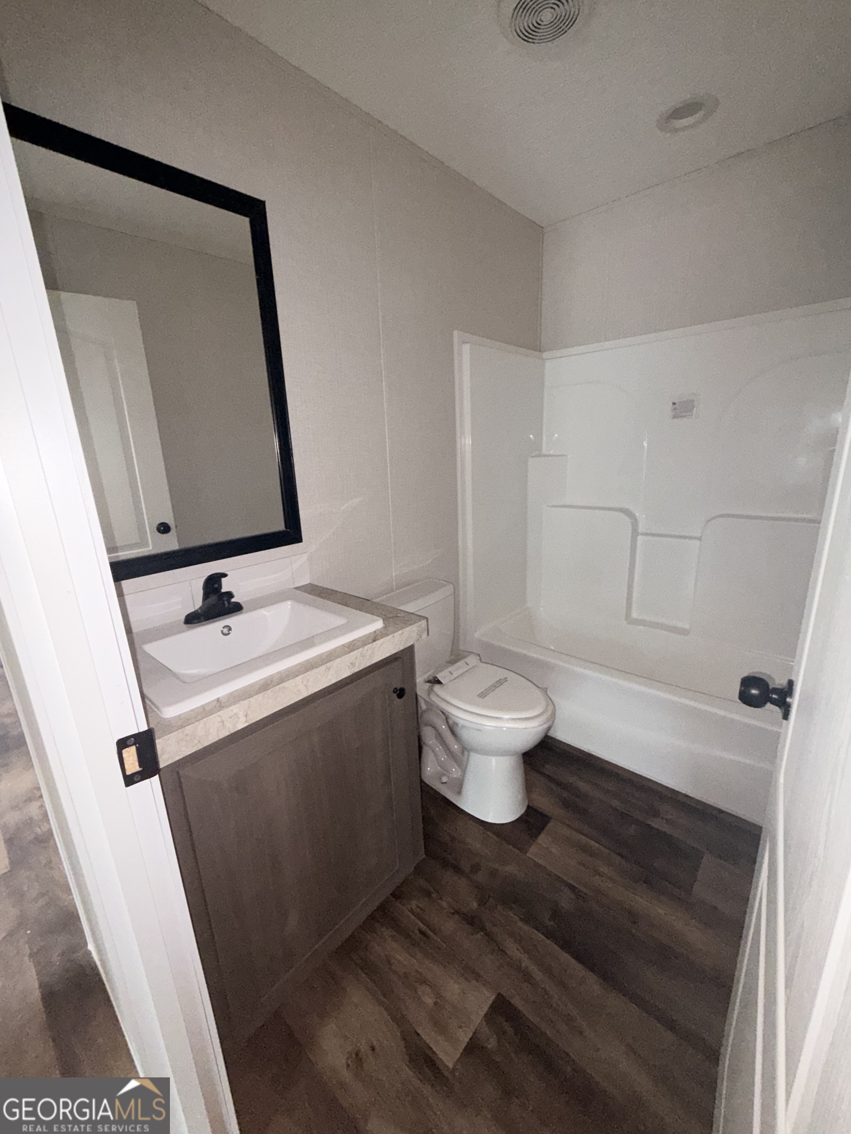 225 Rehoboth Road Bowman, GA 30624 - Photo 7 of 18 a bathroom with a sink and a mirror